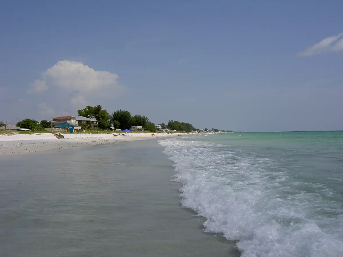 Gentle surf rolling onto the white beach of Anna Maria Island