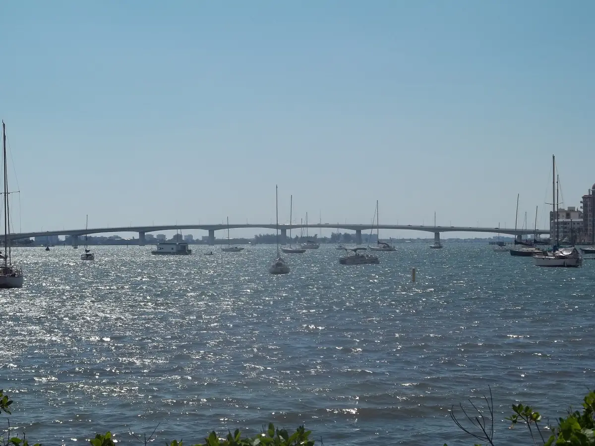 Ringling Bridge crossing sparkling Sarasota Bay with sailboats in the distance