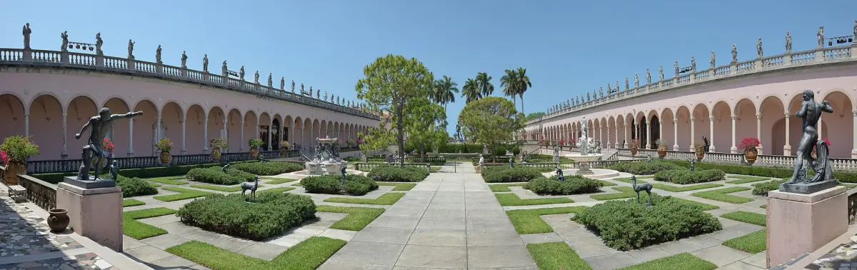 Arcaded courtyard of the Ringling Museum with a formal sculpture garden