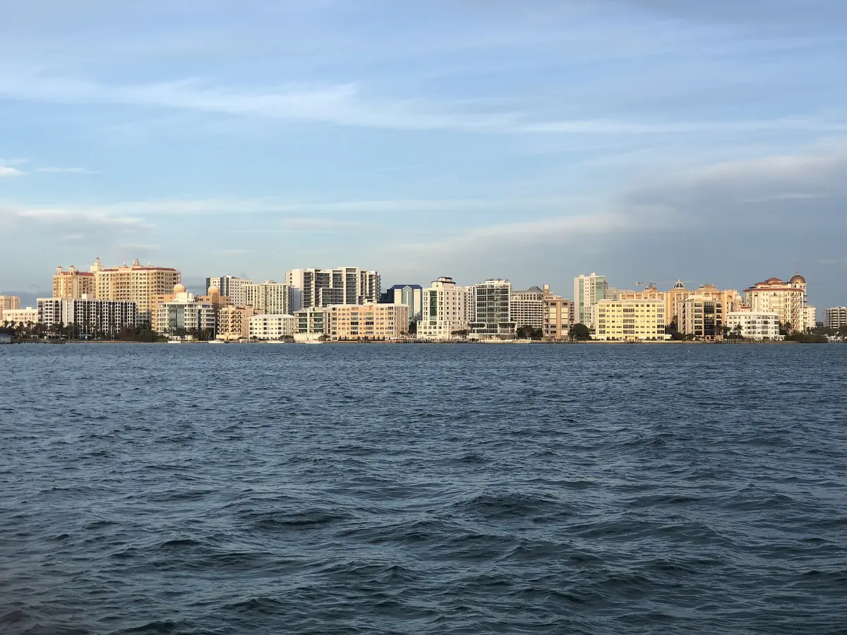 Sarasota skyline with waterfront high-rises across the bay at dusk